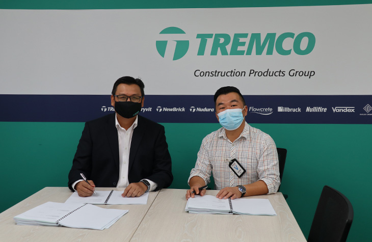 Jackson Koh of Tremco CPG, signing the documents 